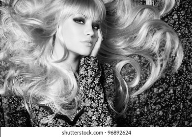 Black and white photo of  beautiful woman with magnificent hair