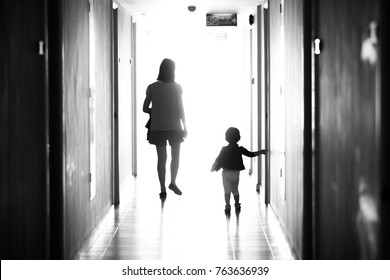 Black And White Photo Behind Mother And Daughter, Walking Away