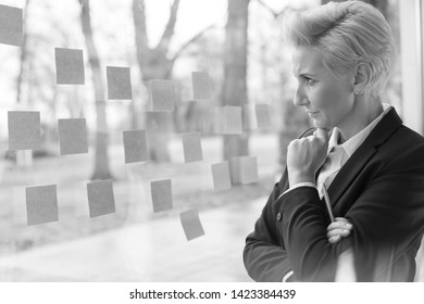 Black And White Photo Of Business People Having A Team Meeting. Warsaw, Poland.