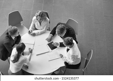 Black And White Photo Of Business People On Meeting