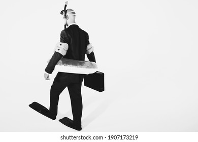 Black And White Photo Of Businessman In Flippers, Inflatable Rubber Ring Holding Briefcase