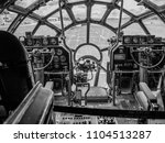 black and white photo of the cockpit of a B29 superfortress airplane.