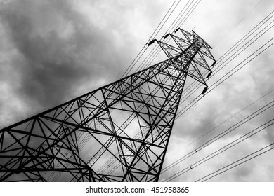 black and white photo of electricity post with rainy cloudy sky before storm - Powered by Shutterstock