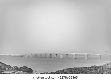 Black and White photo of the epic Hong Kong-Zhuhai-Macao Bridge, viewing from mountain side, Lantau Island