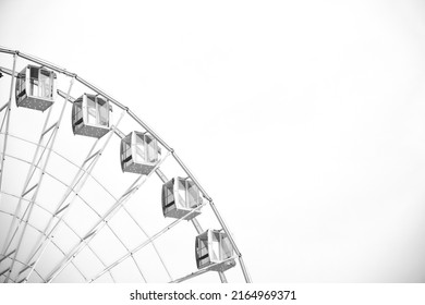 Black and white photo of a Ferris wheel. Can be used as a background.
