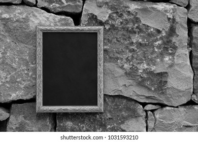 Black And White Photo Frame On A Stone Wall. Mock Up.