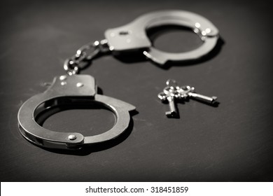 Black and white photo of handcuffs
