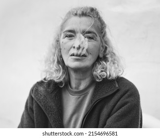 Black And White Photo Of Middle - Aged Woman Exhale Cigarette Smoke