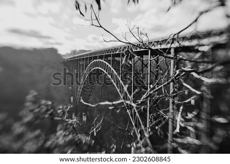 black and white photo of the new river gorge bridge in west virginia