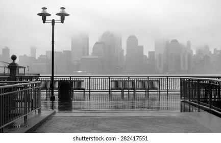 Black and white photo of New York City skyline on a rainy day
 - Powered by Shutterstock