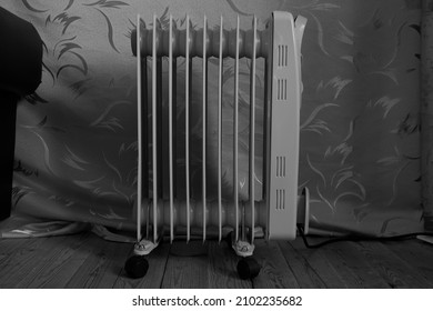 Black And White Photo Of An Oil Heater Powered By Electricity For Residential Heating 