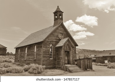 Black and white photo of an old western church