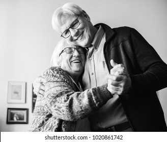 Black And White Photo Of Senior Couple Dancing