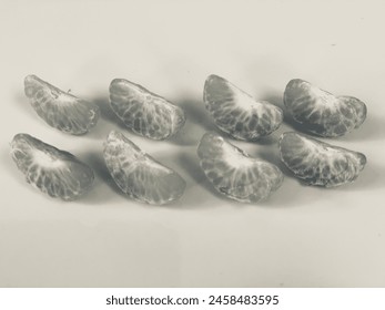 black and white photo of a series of neatly arranged fruits, grapes, oranges, pineapples, pears, apples, strawberries in black and white shades - Powered by Shutterstock