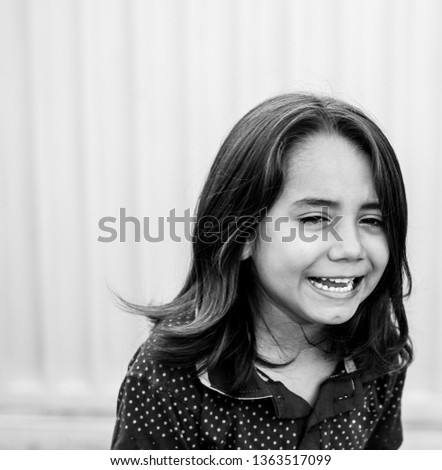 Similar – Happy adorable little girl smiling outdoors.