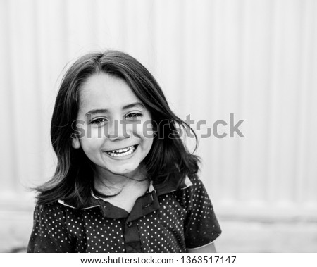 Similar – Happy adorable little girl smiling outdoors.