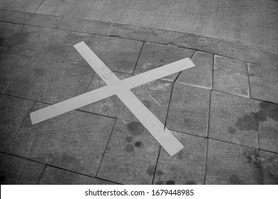 Black And White Photo Of A Street Parking Spot Marked With A Large X Sign