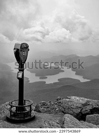 Black and white photo of the view from the top of Whiteface mountain in the Adirondack mountains in New York State with Lake Placid in the background which creates a bit of nostalgic feeling of travel