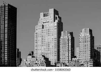 black and white photo of vintage skyscrapers along 15 central park avenue in New York, NY, United States