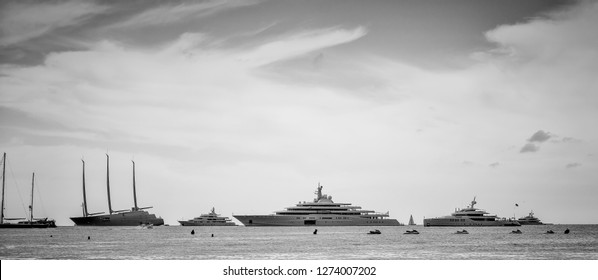 Black And White Photo Of Yachts Worth Billions Of Dollars Aligned In French Riviera