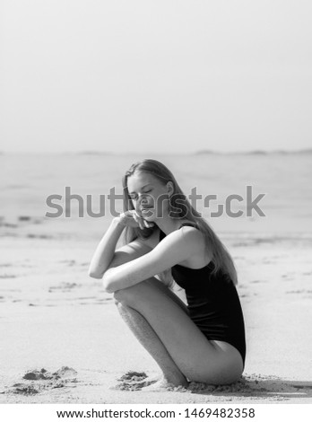 Similar – Young woman on the beach in the sun