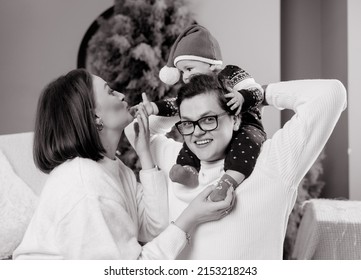 Black And White Photo Of Young Family Mom Dad Son In Winter Meadows In Studio With Winter Decor