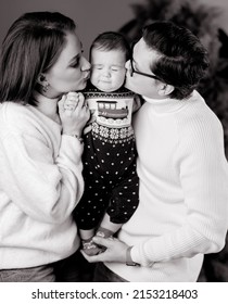 Black And White Photo Of Young Family Mom Dad Son In Winter Meadows In Studio With Winter Decor