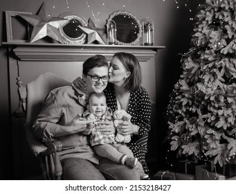 Black And White Photo Of Young Family Mom Dad Son In Winter Meadows In Studio With Winter Decor