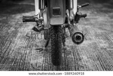 Similar – Image, Stock Photo Wheel and exhaust pipe of motorcycle on road