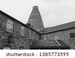 A black and white photograph of a restored bottle kiln or bottle oven of the once thriving ceramic industry in the  Potteries, Stoke on Trent, Staffordshire.