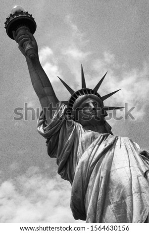 A black and white photograph of the Statue of Liberty.