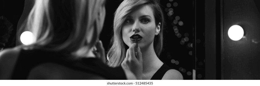 Black And White Photograph Of Women Applying Lipstick
