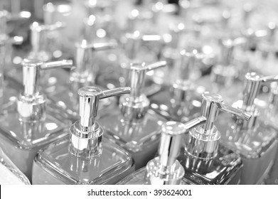 Black and white photography of bottles in row, close up