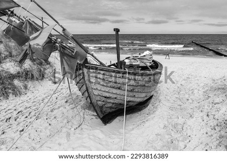 black and white photography, fishing boat at sunset baltic sea usedom on the beach 01