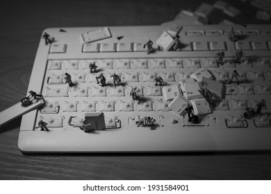 Black And White Picture About Little Worker Men Cleaning A Keyboard, IT Workers, Keyboard Disassembly, Keyboard Cleaning, Keyboard Repair 