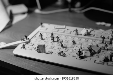 Black And White Picture About Little Worker Men Cleaning A Keyboard, IT Workers, Keyboard Disassembly, Keyboard Cleaning, Keyboard Repair 