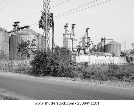 It is black and white picture of an factory