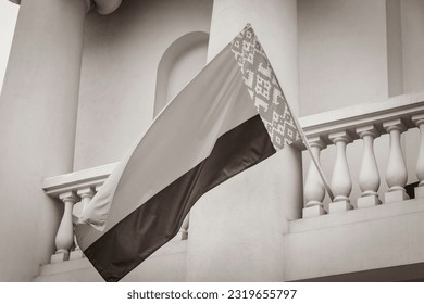 Black and white picture of Flag of Belarus on a building with white background belarusian flag red white green in Minsk Belarus.
