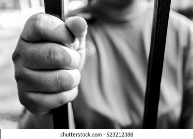 Black And White Picture. Hand In Jail, Concept Of Life Imprisonment