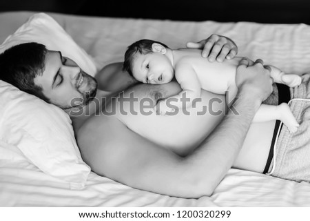 Similar – Image, Stock Photo Man reading with wife and son sleeping