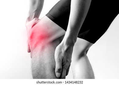 Black And White Picture .Knee Pain .man Stand Hand Caught At The Knee.  Health Concepts