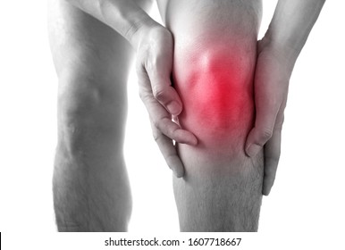 Black And White Picture .Knee Pain .man Stand Hand Caught At The Knee.  Health Concepts