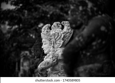 black and white picture of sculptures in bali temple