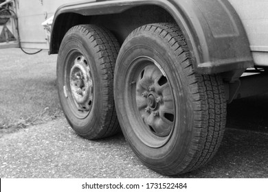 Black And White Picture Of A Tandem Axle From A Car Trailer