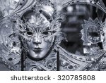 Black and white picture of traditional carnival mask in Venice, Italy