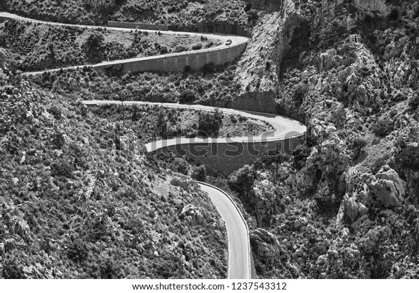 Black and white picture of a winding mountain\
road, Mallorca, Spain.