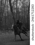 Black and white pictures of jockey and horse training in Chantilly forest before races