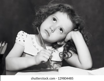 Black and white portrait, the beautiful girl thought about lessons