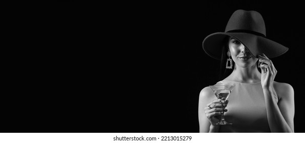 Black and white portrait of beautiful young woman drinking martini on dark background with space for text - Powered by Shutterstock