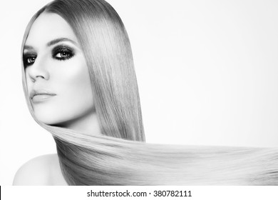 Black And White Portrait Of Beautiful Young Woman With Smokey Eyes And Long Straight Hair